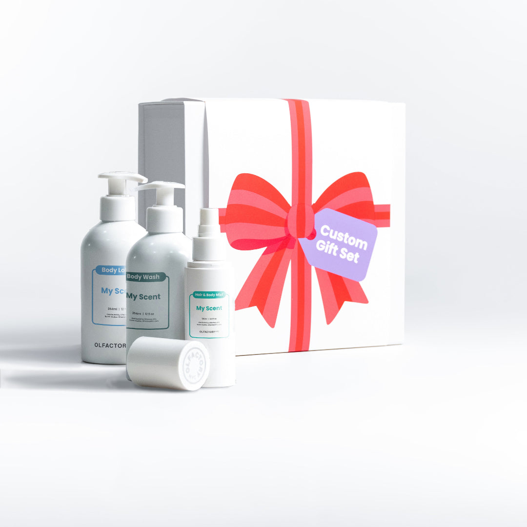 A minimalist desk with a lamp, plant, laptop, notebooks, and coffee beans.